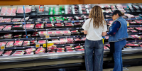 Customers shop for beef at a grocery store in Los Angeles on April 6, 2026.
