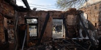 A local resident walks past a destroyed house following an air attack in Odesa on April 11.