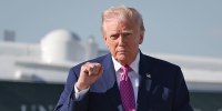 President Donald Trump talks to reporters before boarding Air Force One on April 10, 2026 at Joint Base Andrews, Md.
