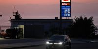 Gas prices are displayed at a station on April 8, 2026 in El Segundo, Calif.