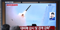 A news broadcast with file footage of a North Korean missile test, at a train station in Seoul on April 19.