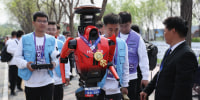 Winner The "Blitz" robot from smartphone manufacturer Honor accept media interviews after the 2026 Beijing E-Town Humanoid Robot Half-marathon on April 19.
