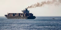 U.S forces patrol near the Iranian-flagged cargo ship M/V Touska after it was boarded and seized by U.S. forces on Sunday, at a location given as the Arabian Sea, in this handout image released April 20, 2026.