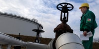 An engineer checks the receiving area of the Druzhba oil pipeline in Szazhalombata, Hungary, 