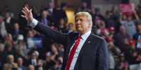 President Donald Trump waves during a rally in Topeka, Kan., on Oct. 6, 2018.