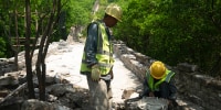 Construction workers at Phase 5 of the Great Wall reconstruction in Jiankou, China on Tuesday.