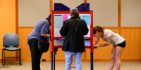Voters mark their ballots in Ohio