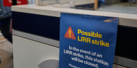 Image: A sign warns commuters of a potential Long Island Rail Road strike at Penn Station in New York.