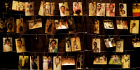 Family photographs of some of those who died hang on display in an exhibition at the Kigali Genocide Memorial centre in the capital Kigali, Rwanda.