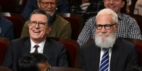 The Late Show with Stephen Colbert and guest David Letterman sitting with the audience during a show.