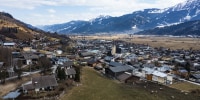 Drone shot, view of village with parish church, Piesendorf, Pinzgau, Salzburg province, Austria, Europe