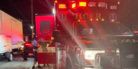 A firetruck parked outside at night