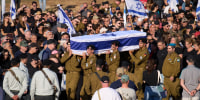 Image: Israeli soldiers carry the casket of Staff Sgt. Noam Hamburger, who was killed in a Lebanese drone attack on northern Israel, during his funeral in Atlit, Israel.
