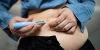 Image: Close-up of a person administering semaglutide injection for weight loss.