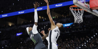 SAN ANTONIO, TEXAS - MAY 06: Jaden McDaniels #3 of the Minnesota Timberwolves shoots the ball against Victor Wembanyama #1 of the San Antonio Spurs during the third quarter in Game Two of the Second Round of the NBA Western Conference Playoffs at Frost Bank Center on May 06, 2026 in San Antonio, Texas. NOTE TO USER: User expressly acknowledges and agrees that, by downloading and or using this photograph, User is consenting to the terms and conditions of the Getty Images License Agreement. (Photo by Ronald Cortes/Getty Images)