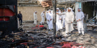 Kuwaiti officials inspect damage inside a terminal at Kuwait International Airport following a drone and missile attack, in Kuwait City