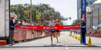 Conner Mantz crosses the finish line to place first during the 2024 U.S. Olympic Team Trials
