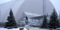A view of the containment vessel that protects the remains of reactor number four at the former Chernobyl nuclear power plant and built to contain radiation, after a drone attack in February 2025.