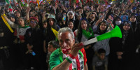 A man blows a plastic trumpet during a rally in support of Iran's World Cup team in Tehran on May 13, 2026.