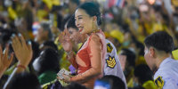 Princess Bajrakitiyabha Mahidol waves at the royalist