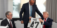 President Trump is gifted a 47 jersey by Germany's Chancellor Friedrich Merz at the G7 summit in Evian-les-Bains, France on June 16, 2026. 