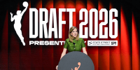 Cathy Engelbert speaks at a podium, behind her in large white text reads "Draft 2026"