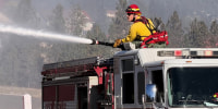 Fire crews battle the Upriver Fire on Tuesday, June 16, 2026, east of Spokane, Washington.