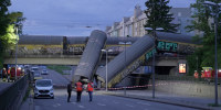 Freight Train Plunges Off a Bridge in Munich