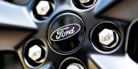 A Ford logo in the center of the rim of a wheel