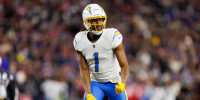 FOXBOROUGH, MASSACHUSETTS - JANUARY 11: Quentin Johnston #1 of the Los Angeles Chargers gets set during the second quarter of an NFL wild card playoff football game against the New England Patriots at Gillette Stadium on January 11, 2026 in Foxborough, Massachusetts. (Photo by Brooke Sutton/Getty Images)
