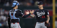 PHOENIX, ARIZONA - JUNE 21: Anthony Banda #43 of the Minnesota Twins interacts with Alex Jackson #70 after the MLB game against the Arizona Diamondbacks at Chase Field on June 21, 2026 in Phoenix, Arizona. The Twins won 4-2. (Photo by Jeremy Chen/Getty Images)
