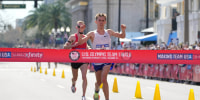 Feb 3, 2024; Orlando, FL, USA; Conner Mantz (right) and Clayton Young place first and second in 2:09:05 and 2:09:06 during the US Olympic Marathon Team Trials. Mandatory Credit: Kirby Lee-USA TODAY Sports