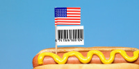Photo illustration of a hot dog with an American flag and price sticker 