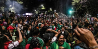 People gather at the Independence Angel to celebrate.