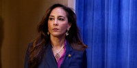 Harmeet Dhillon arrives for a news conference at the Justice Department.