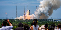 A Long March-10 carrier rocket blasts off on July 10, 2026 in Wenchang, China. 