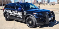 An East St. Louis Police vehicle is parked outside