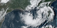 A color satellite image of a tropical depression in the ocean.