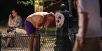 A man cools down at a public drinking fountain along the Canal Saint-Martin as France experiences a heatwave, in Paris on June 25, 2026.