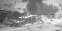 Smoke rises from an explosion at an unknown location, during what the U.S. Central Command (CENTCOM) says are strikes on Iranian military targets, in this screengrab taken from a handout video released on July 23, 2026.