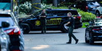 Law enforcement investigate the scene of a fatal house fire in Grand Haven Township in Michigan.