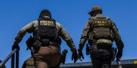 The Ventura County Government Center has been the site of tense standoffs and confrontations in recent weeks between US Immigration and Customs Enforcement (ICE) agents, local community observers, and protesters. (Photo by Blake Fagan / AFP via Getty Images)