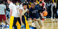 Michigan forward Yaxel Lendeborg (23) warms up with assistant coach Mike Boynton Jr. ahead of the NCAA Tournament Sweet 16 between Michigan and Alabama at United Center in Chicago on Friday, March 27, 2026.