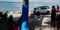 People enjoy their leisure time by the sea.
