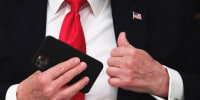 President Trump puts his phone in his pocket during a roundtable at the White House June 18, 2020.