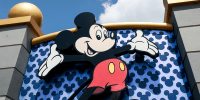 A Mickey Mouse sign showing Mickey smiling with his arms outstretched