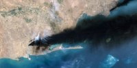 Satellite Imagery Of The Aramco Oil Terminal At Jizan In Saudi Arabia, black smoke can be seen billowing