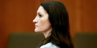 Side profile of Lindsay Clancy sitting inside of a court room