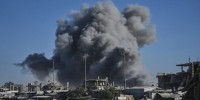 Smoke rises following a strike.