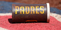 WASHINGTON, DC - JULY 20: A view of the San Diego Padres logo on a bat weight during the game against the Washington Nationals at Nationals Park on July 20, 2025 in Washington, DC. (Photo by G Fiume/Getty Images)